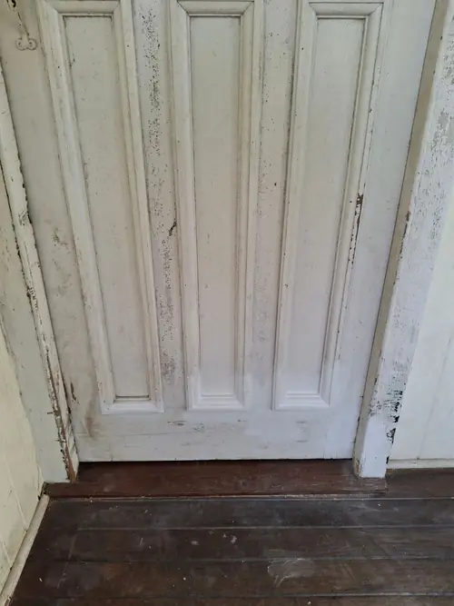 Repair of an entry door that has been chewed by a dog