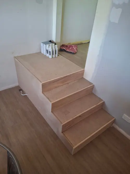 Installation of a new stair that will be screened with Charcoal battens later on . The Power point that was under has been moved .