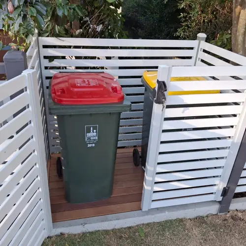 We've built a platform for the bins at the front of this house to be more practical as they used to be in the garage with a steep driveway.