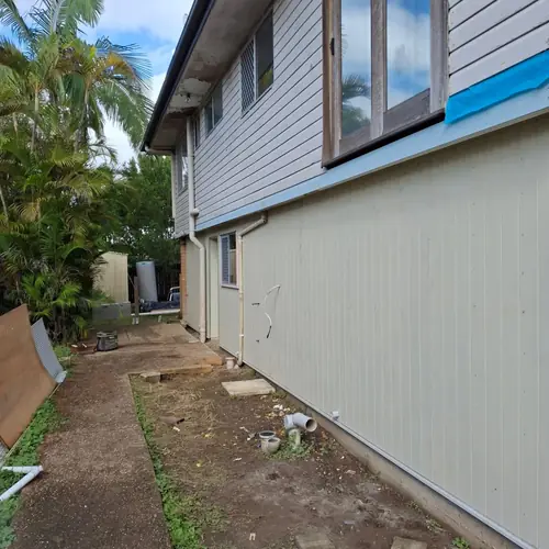 Going from tarps to a house. The concrete was at the same height from inside to outside so it had to be cut to create a stepdown for water infiltration. A new frame has been built and a termite barrier has been installed with a z flashing. A new door and window have been installed as well. More to come..