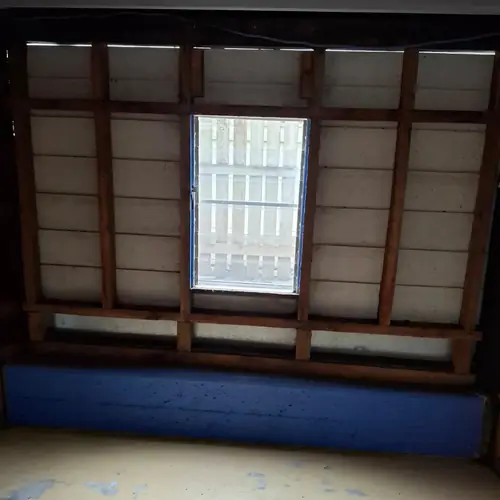 A storage room under a queenslander converted in a bedroom.