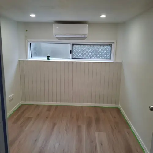 A storage room under a queenslander converted in a bedroom.
