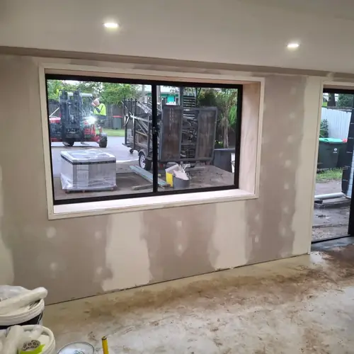 Last part of this job. Installation of a new door and a new window with customised reveals. We've built a double walls to hide the bricks. The walls have been insulated, a termite barrier has been installed and new chamfer boards have been installed