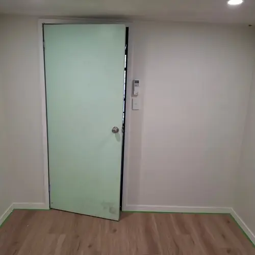 A storage room under a queenslander converted in a bedroom.