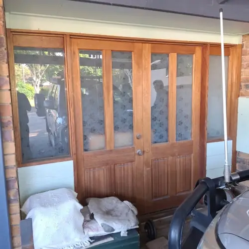 Replacement of french doors with a window.