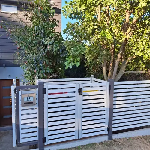 We've built a platform for the bins at the front of this house to be more practical as they used to be in the garage with a steep driveway.