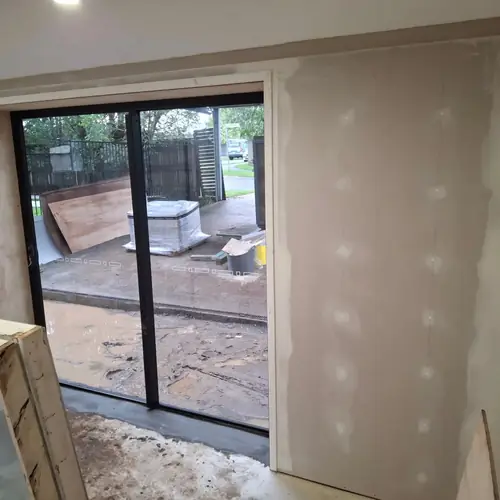 Last part of this job. Installation of a new door and a new window with customised reveals. We've built a double walls to hide the bricks. The walls have been insulated, a termite barrier has been installed and new chamfer boards have been installed