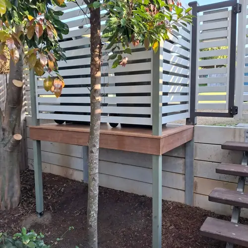 We've built a platform for the bins at the front of this house to be more practical as they used to be in the garage with a steep driveway.