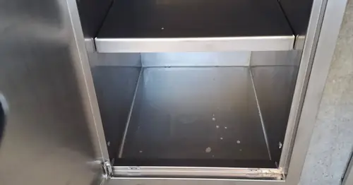 We've built an external kitchen with a steel frame, cement sheet (easylap) cladding for the tiles. We've installed the stainless steel doors, drawers, rubbish bin and shelves.