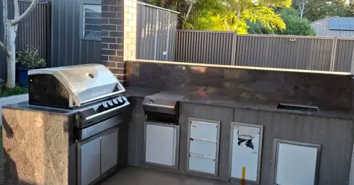 We've built an external kitchen with a steel frame, cement sheet (easylap) cladding for the tiles. We've installed the stainless steel doors, drawers, rubbish bin and shelves.
