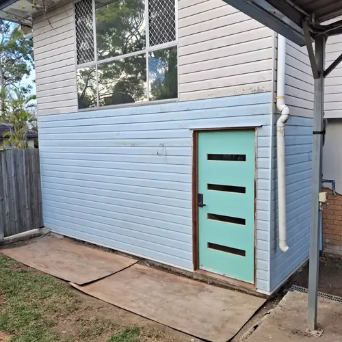 New entry door and hardware. The ground floor has been re framed to be 70mm of the ground with a termite barier. The concrete outside has be demolished by others as there was no step down from inside to outside.