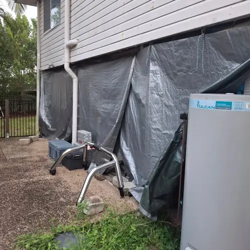 Going from tarps to a house. The concrete was at the same height from inside to outside so it had to be cut to create a stepdown for water infiltration. A new frame has been built and a termite barrier has been installed with a z flashing. A new door and window have been installed as well. More to come..