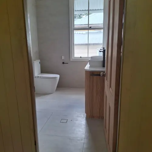 2 bathrooms renovated: The ensuite was 900mm wide, We demolished the wall to extend it to 1200mm